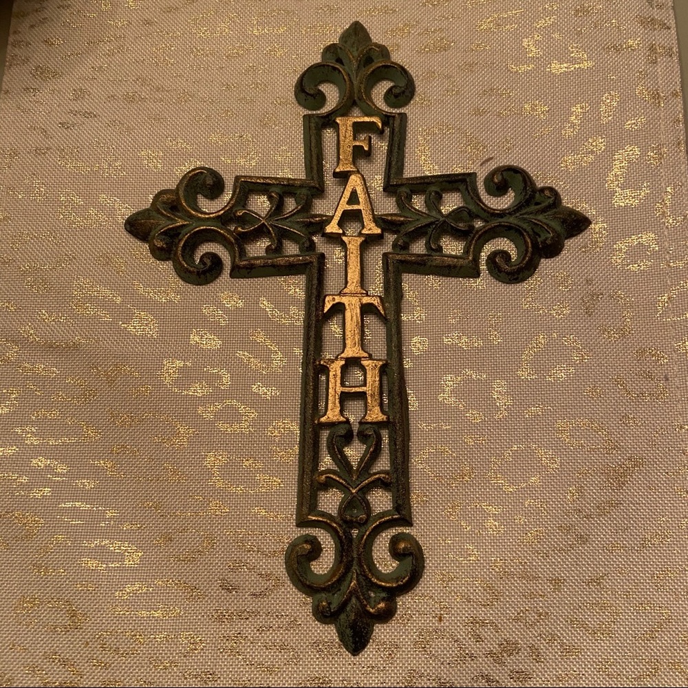 Metal hanging cross with the word FAITH